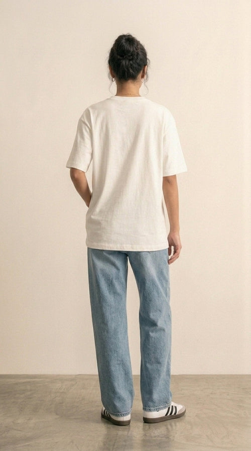 Hallberd Women's Oversized T-Shirt in white, back view, with light-wash jeans